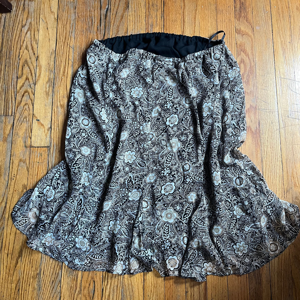 (18) Tan and black floral ruffle midi skirt