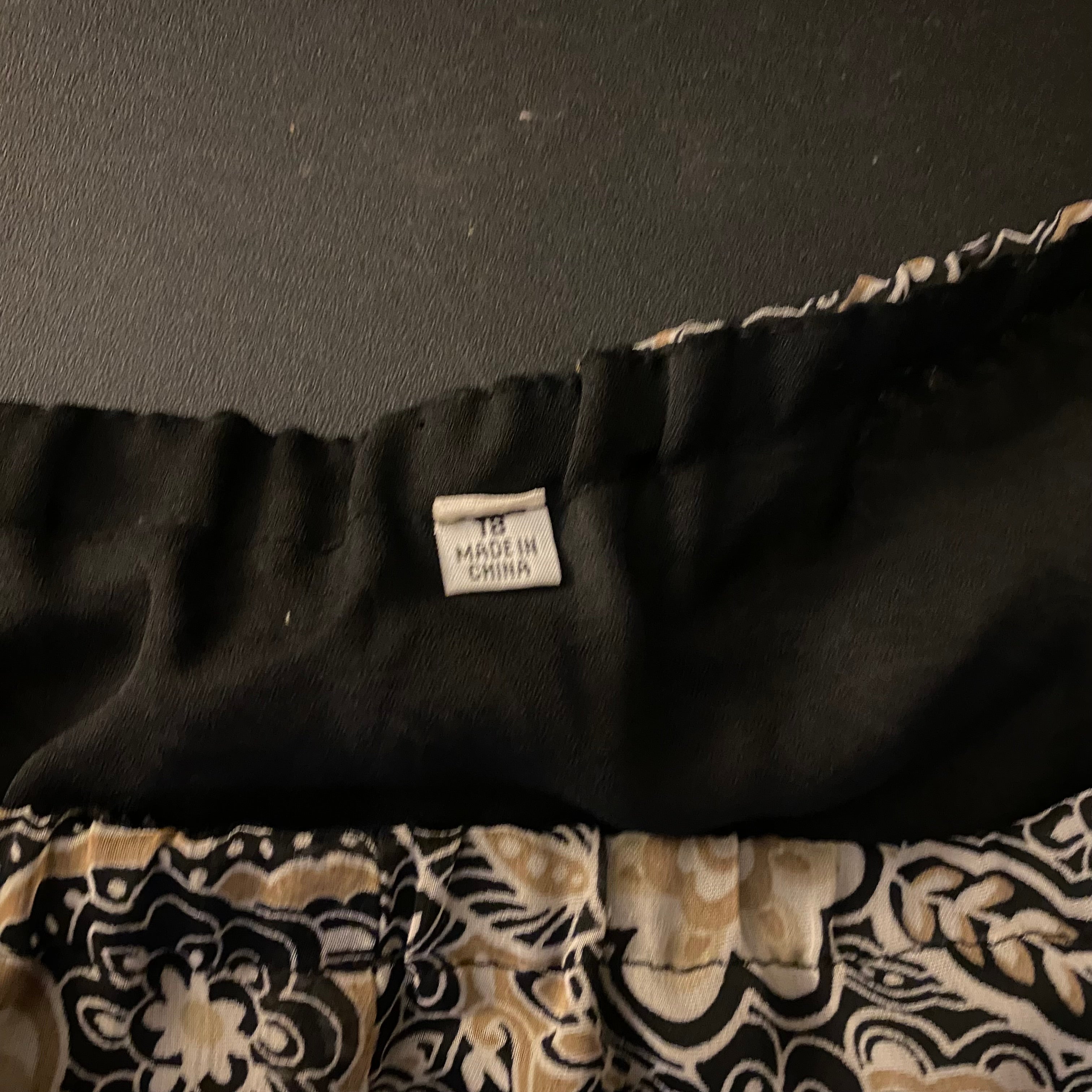 (18) Tan and black floral ruffle midi skirt